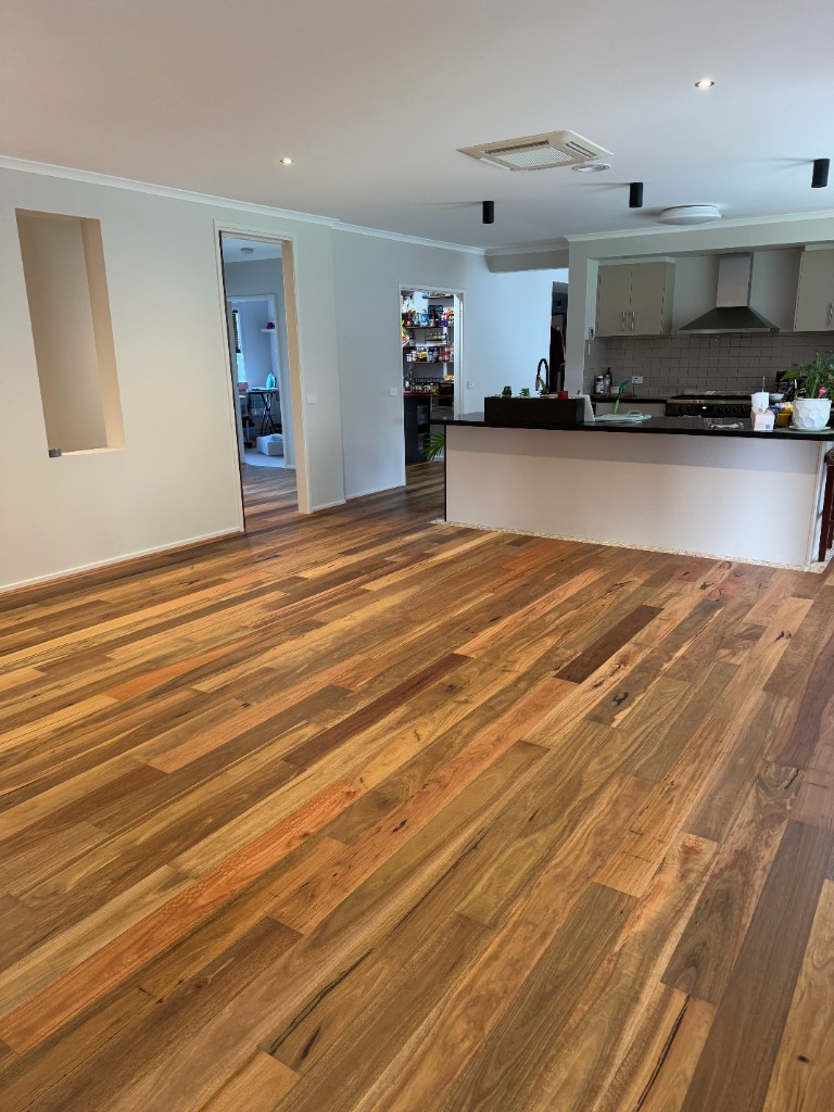 Tom from Gippsland Flooring Centre installing hardwood timber flooring in a Sale, Victoria home