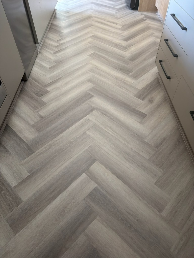 Herringbone hybrid flooring — kitchen